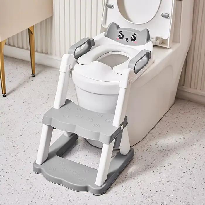 Nouveau siège de toilette pliable pour enfants coussin de toilette d'entraînement pot portable auxiliaire pour bébés en plastique avec dessin animé blanc ou noir