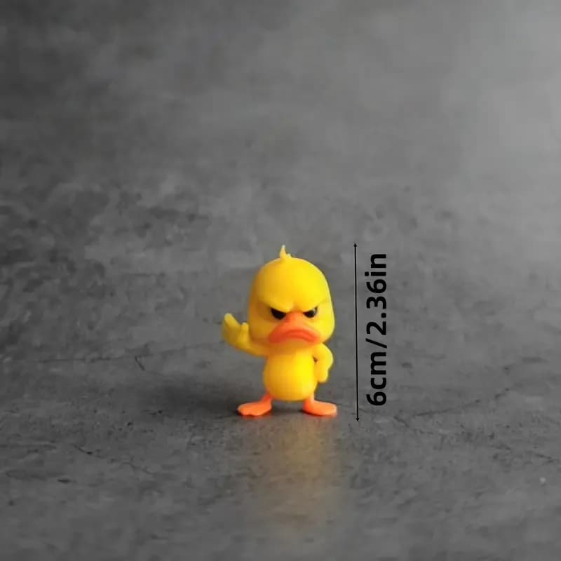 Statue de canard jaune en colère avec geste rejetant. Mini figurine drôle pour bureau, voiture, déco