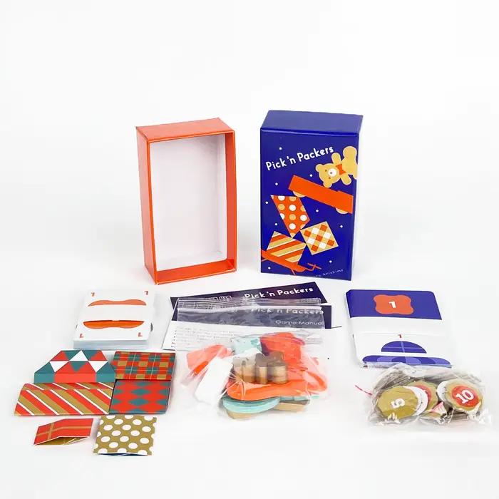 Jeu de société "Pick 'n Packers": Édition Deluxe. Utilisez vos doigts pour transporter des cadeaux - Jeu de fête très interactif et amusant