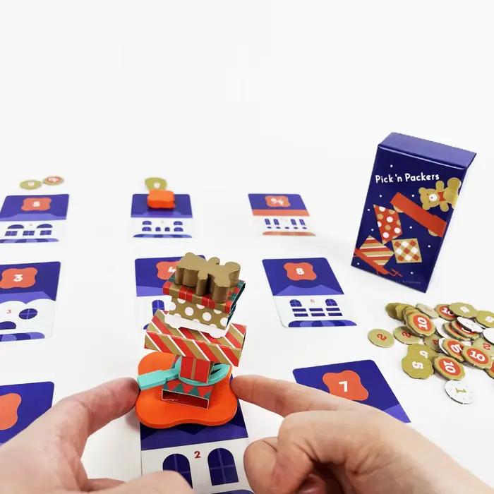 Jeu de société "Pick 'n Packers": Édition Deluxe. Utilisez vos doigts pour transporter des cadeaux - Jeu de fête très interactif et amusant