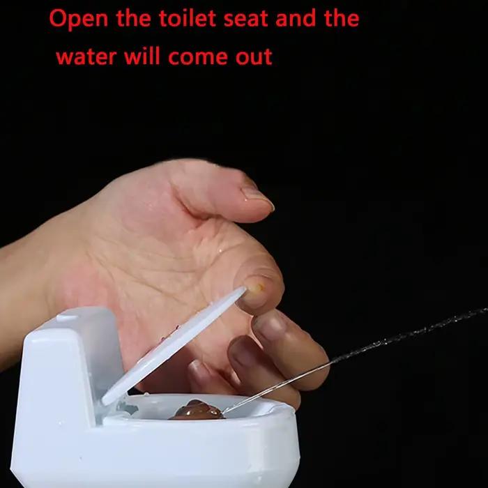 1PC-nouveau intéressant merde Spray farce jouet blague culinaire jouets Mini arroseur toilette pistolet Simulation